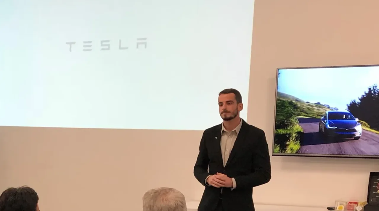Luis Gustems hosting a corporate event on stage